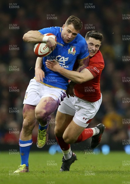 110318 - Wales v Italy - Natwest 6 Nations Championship - Tommaso Benvenuti of Italy is tackled by Owen Watkin of Wales