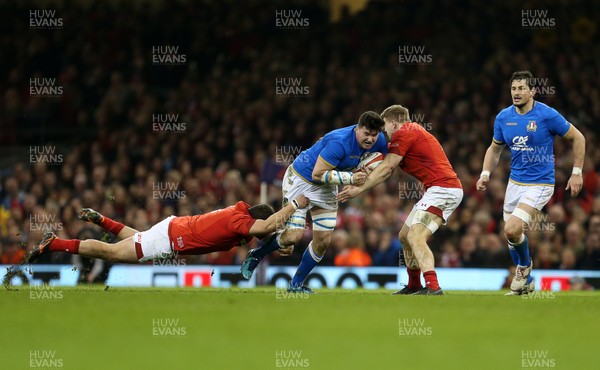 110318 - Wales v Italy - Natwest 6 Nations Championship - Sebastian Negri of Italy is tackled by Nicky Smith and James Davies of Wales