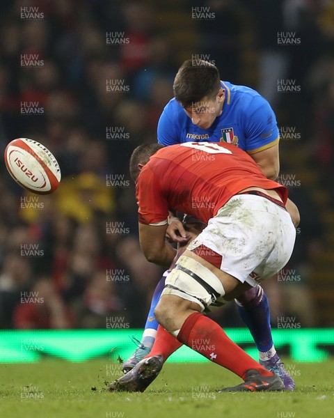 110318 - Wales v Italy - Natwest 6 Nations Championship - Tommaso Allan of Italy is tackled by Taulupe Faletau of Wales
