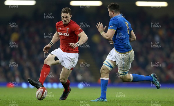 110318 - Wales v Italy - Natwest 6 Nations Championship - George North of Wales chips the ball past Sebastian Negri of Italy