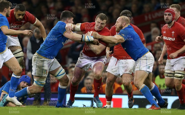 110318 - Wales v Italy - Natwest 6 Nations Championship - Hadleigh Parkes of Wales is tackled by Sebastian Negri and Leonardo Ghiraldini of Italy