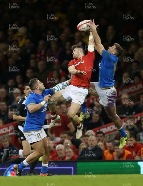 110318 - Wales v Italy - Natwest 6 Nations Championship - Steff Evans of Wales goes up for the ball with Tommaso Benvenuti of Italy