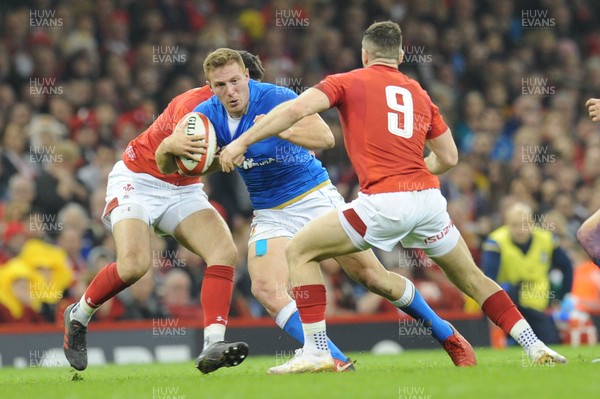 110318 - Wales v Italy - NatWest 6 Nations Championship - Giulio Bisegni of Italy  is tackled by Owen Watkin of Wales and Gareth Davies of Wales 