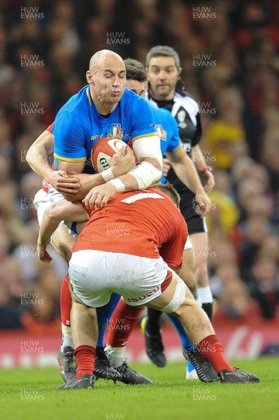 110318 - Wales v Italy - NatWest 6 Nations Championship - Sergio Parisse of Italy is tackled by James Davies of Wales 