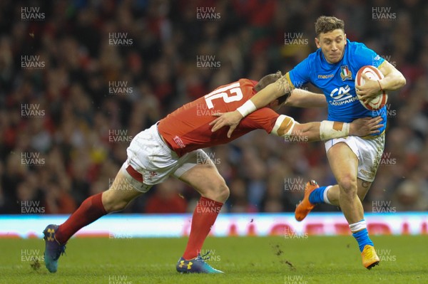 110318 - Wales v Italy - NatWest 6 Nations Championship - Matteo Minozzi of Italy is tackled by Hadleigh Parkes of Wales 