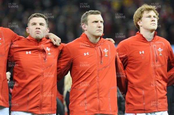 110318 - Wales v Italy - NatWest 6 Nations Championship - Elliot Dee, Hadleigh Parkes and Rhys Patchell of Wales during the anthem