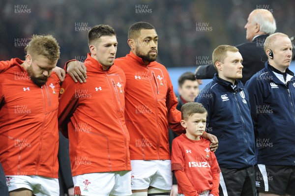 110318 - Wales v Italy - NatWest 6 Nations Championship - Justin Tipuric and Taulupe Faleatu of Wales with mascot