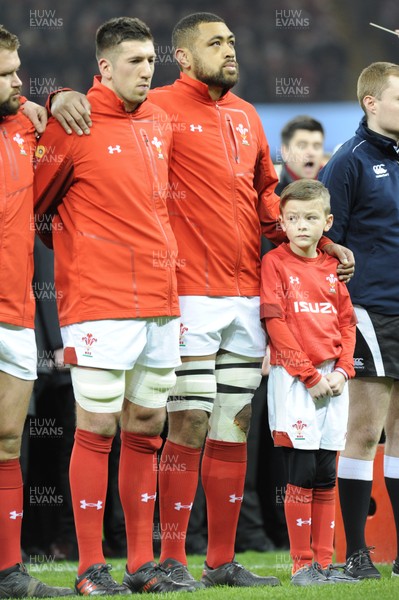 110318 - Wales v Italy - NatWest 6 Nations Championship - Justin Tipuric and Taulupe Faleatu of Wales with mascot