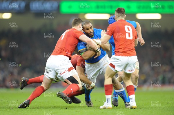 110318 - Wales v Italy - NatWest 6 Nations Championship - Maxime Mbanda of Italy is tackled by George North of Wales 