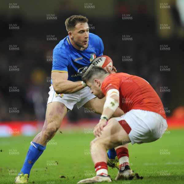 110318 - Wales v Italy - NatWest 6 Nations Championship - Tommaso Benvenuti of Italy is tackled by Steff Evans of Wales 