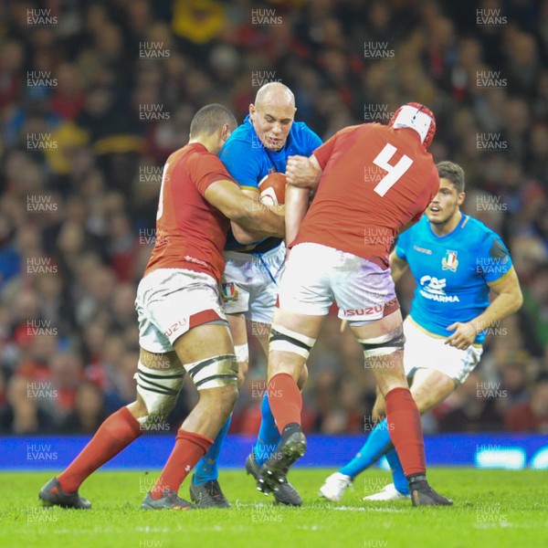 110318 - Wales v Italy - NatWest 6 Nations Championship - Sergio Parisse of Italy  is tackled by Taulupe Faletau of Wales  and Cory Hill of Wales 