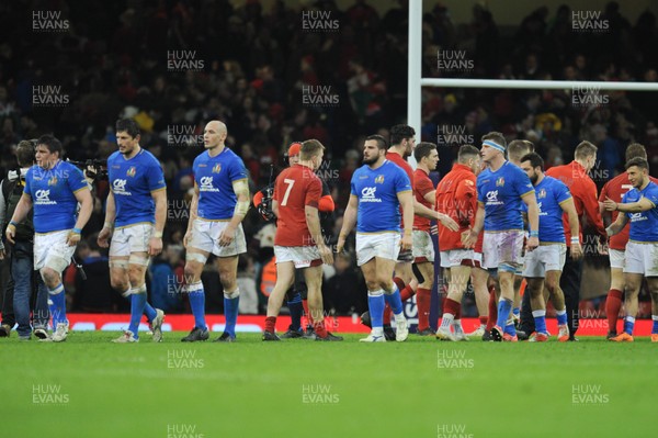110318 - Wales v Italy - NatWest 6 Nations Championship - Wales and Italians players shake hands at the final whistle