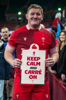 140326 - Wales v Italy - Guinness Six Nations - Rhys Carre poses up with a sign saying ‘ Keep Calm and Carre on’ after the game 