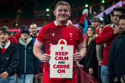 140326 - Wales v Italy - Guinness Six Nations - Rhys Carre poses up with a sign saying ‘ Keep Calm and Carre on’ after the game 