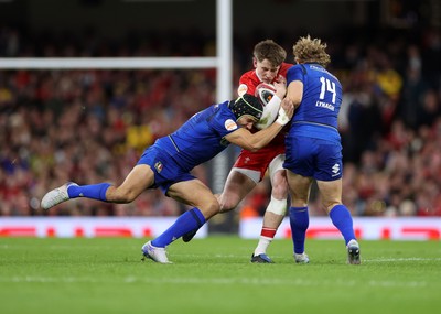 140326 - Wales v Italy - Guinness Six Nations Championship - Ellis Mee of Wales is tackled by Juan Ignacio Brex and Louis Lynagh of Italy 