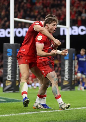 140326 - Wales v Italy - Guinness Six Nations Championship - Dan Edwards of Wales celebrates scoring a try with team mates