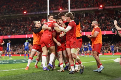 140326 - Wales v Italy - Guinness Six Nations Championship - Dan Edwards of Wales celebrates scoring a try with team mates