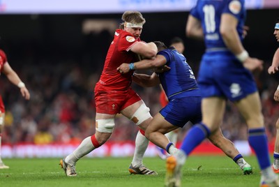 140326 - Wales v Italy - Guinness Six Nations Championship - Aaron Wainwright of Wales is tackled by Muhamed Hasa of Italy 