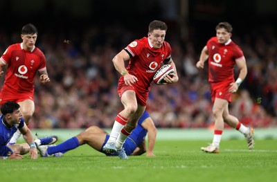 140326 - Wales v Italy - Guinness Six Nations Championship - Josh Adams of Wales breaks past Monty Ioane of Italy 