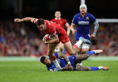 140326 - Wales v Italy - Guinness Six Nations Championship - Josh Adams of Wales breaks past Monty Ioane of Italy 