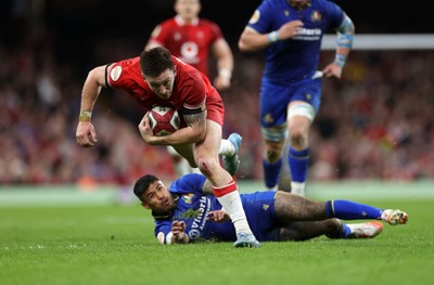140326 - Wales v Italy - Guinness Six Nations Championship - Josh Adams of Wales breaks past Monty Ioane of Italy 