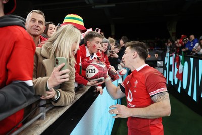 140326 - Wales v Italy - Guinness Six Nations Championship - Josh Adams of Wales with fans
