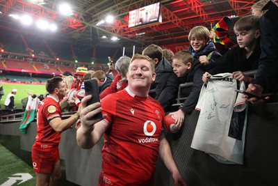 140326 - Wales v Italy - Guinness Six Nations Championship - Rhys Carre of Wales with fans
