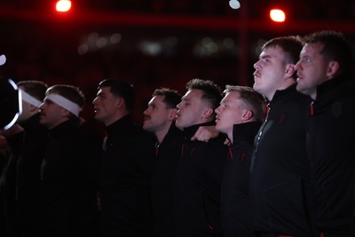 140326 - Wales v Italy - Guinness Six Nations Championship - Jarrod Evans of Wales sings the anthem