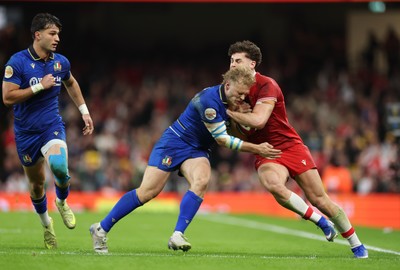 140326 - Wales v Italy, Guinness Six Nations 2026 - Eddie James of Wales is challenged by Louis Lynagh of Italy