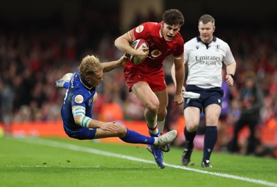 140326 - Wales v Italy, Guinness Six Nations 2026 - Eddie James of Wales is challenged by Louis Lynagh of Italy