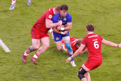 140326 - Wales v Italy - Guinness Six Nations - Lorenzo Pani of Italy is tackled by Rhys Carre of Wales