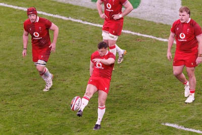 140326 - Wales v Italy - Guinness Six Nations - Jarrod Evans of Wales kicks for touch