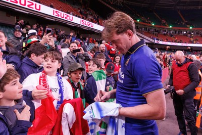 140326 - Wales v Italy - Guinness Six Nations - Federico Ruzza of Italy signs a shirt for fans at the end of the match