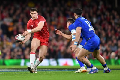 140326 - Wales v Italy - Guinness Men's Six Nations - Joe Hawkins of Wales is challenged by Paolo Garbisi of Italy