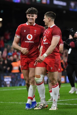 140326 - Wales v Italy - Guinness Men's Six Nations - Eddie James of Wales and Jarrod Evans of Wales celebrate the win at full time