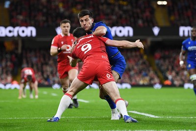 140326 - Wales v Italy - Guinness Men's Six Nations - Lorenzo Cannone of Italy attempts to run in to score a try but is held by Tomos Williams of Wales