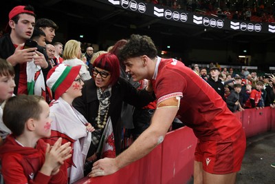 140326 - Wales v Italy - Guinness Men's Six Nations - Eddie James of Wales with fans at full time