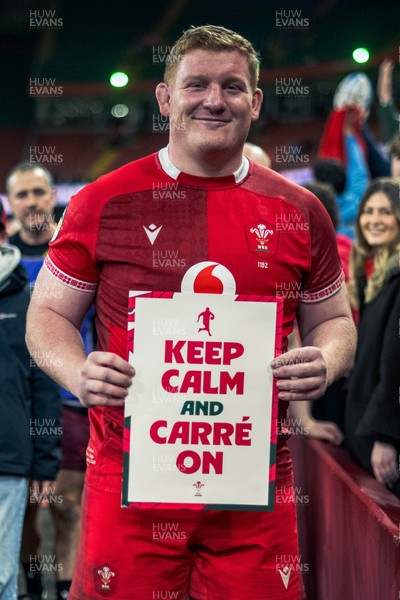 140326 - Wales v Italy - Guinness Six Nations - Rhys Carre poses up with a sign saying ‘ Keep Calm and Carre on’ after the game 