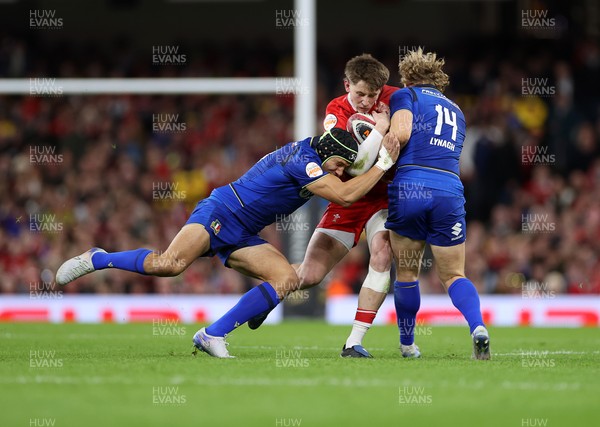 140326 - Wales v Italy - Guinness Six Nations Championship - Ellis Mee of Wales is tackled by Juan Ignacio Brex and Louis Lynagh of Italy 