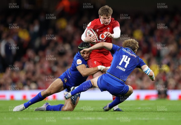 140326 - Wales v Italy - Guinness Six Nations Championship - Ellis Mee of Wales is tackled by Juan Ignacio Brex and Louis Lynagh of Italy 