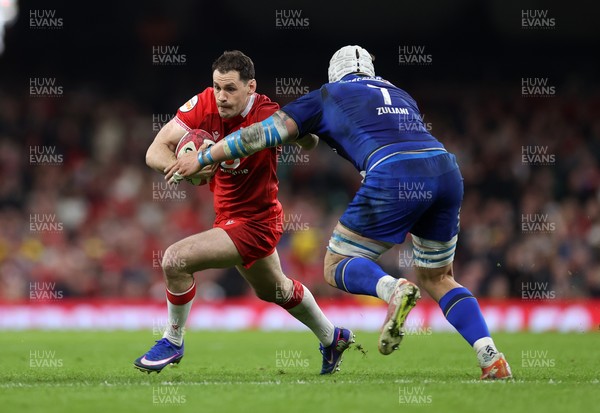 140326 - Wales v Italy - Guinness Six Nations Championship - Tomos Williams of Wales is tackled by Manuel Zuliani of Italy 