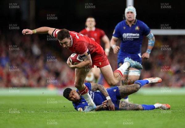 140326 - Wales v Italy - Guinness Six Nations Championship - Josh Adams of Wales breaks past Monty Ioane of Italy 