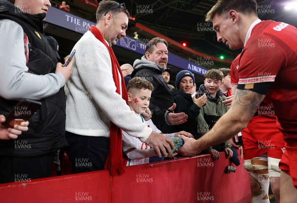 140326 - Wales v Italy - Guinness Six Nations Championship - Josh Adams of Wales with fans