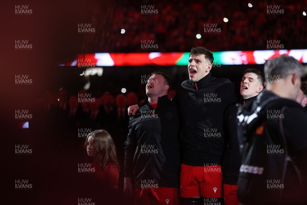 140326 - Wales v Italy - Guinness Six Nations Championship - Dewi Lake and Dafydd Jenkins of Wales sing the anthem