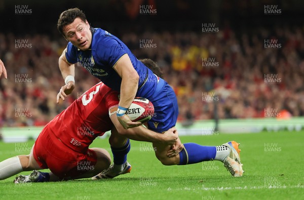140326 - Wales v Italy, Guinness Six Nations 2026 - Paolo Garbisi of Italy looks to pass as Eddie James of Wales tackles