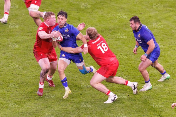 140326 - Wales v Italy - Guinness Six Nations - Lorenzo Pani of Italy is tackled by Rhys Carre and Archie Griffin of Wales