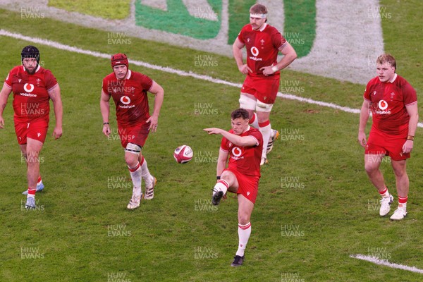 140326 - Wales v Italy - Guinness Six Nations - Jarrod Evans of Wales kicks for touch