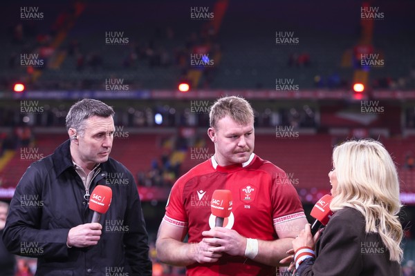 140326 - Wales v Italy - Guinness Six Nations - Dewi Lake of Wales speaks with former Wales fly-half Stephen Jones,  and Sara Elgan of S4C at the end of the match