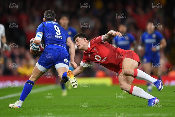 140326 - Wales v Italy - Guinness Men's Six Nations - Alessandro Fusco of Italy is challenged by Louis Rees-Zammit of Wales