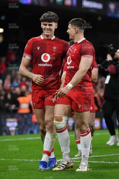 140326 - Wales v Italy - Guinness Men's Six Nations - Eddie James of Wales and Joe Hawkins of Wales celebrate the win at full time